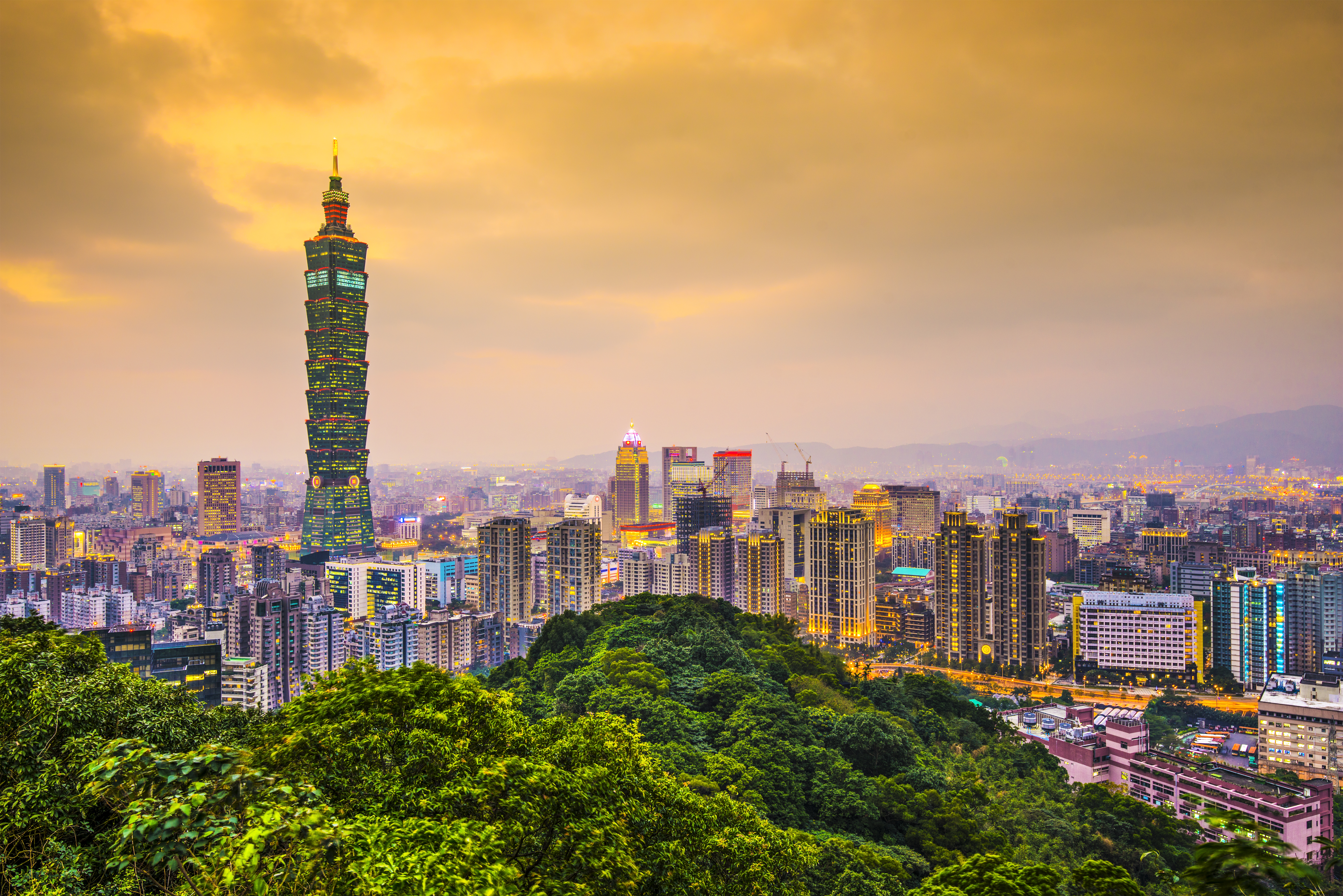 KJ Reports, Taiwan — The Legislative Yuan building in Taipei captured at a low angle with a dramatic, overcast sky to symbolise political tension